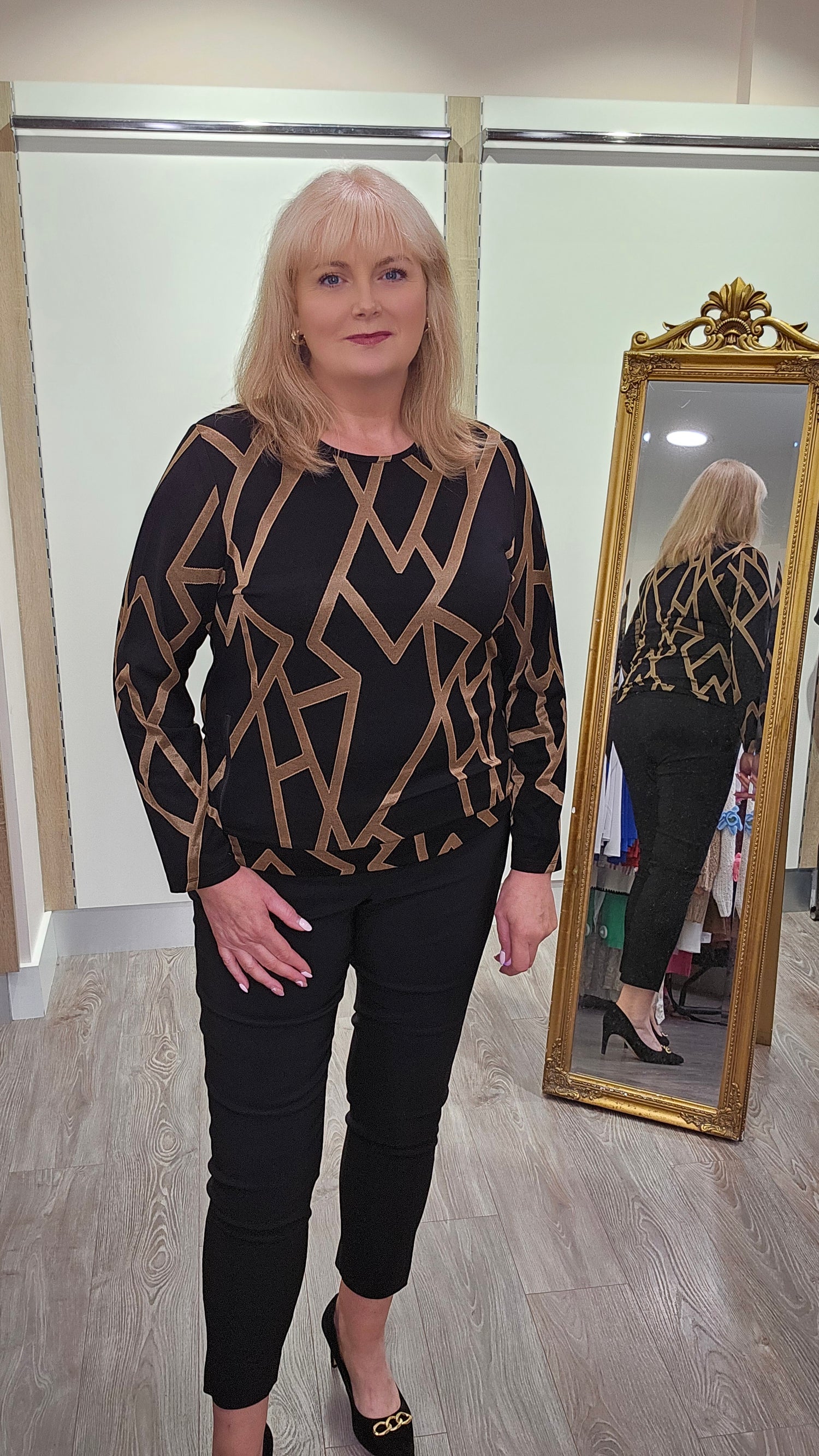 Libra Black and Gold Geo print round neck top with long sleeve and zip detail