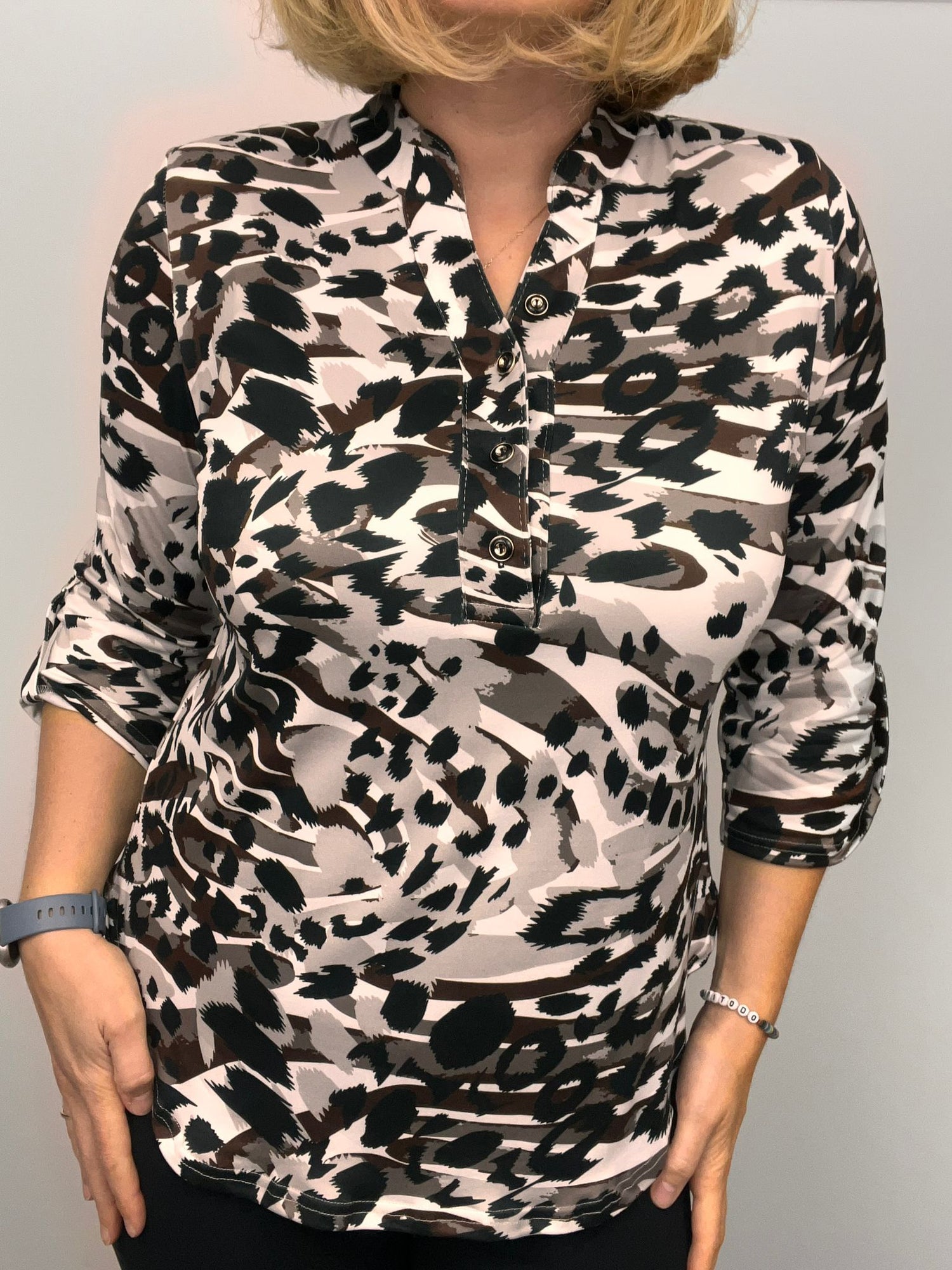 Ilona Animal print top with 1/4 button and stand up collar