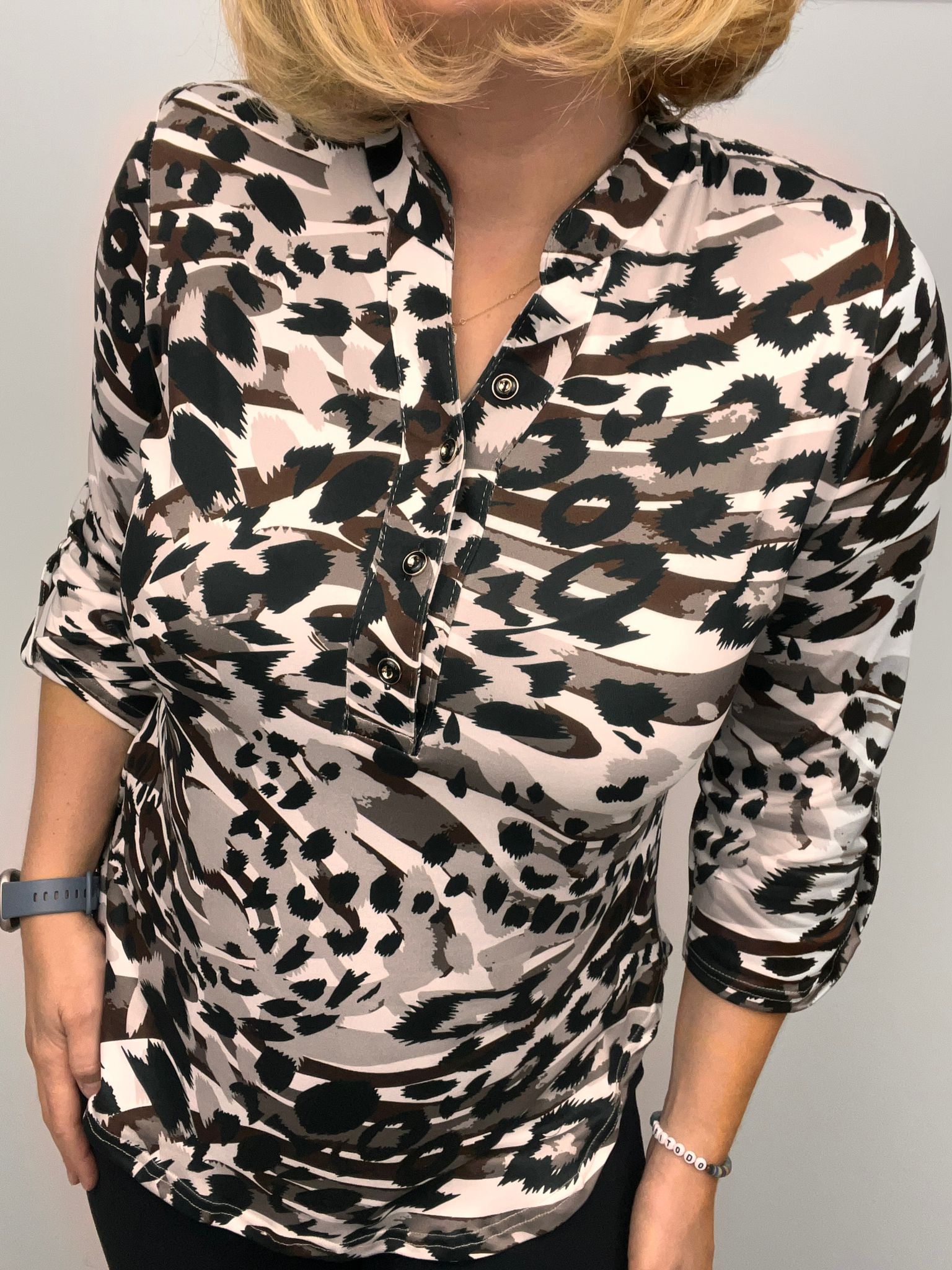 Ilona Animal print top with 1/4 button and stand up collar