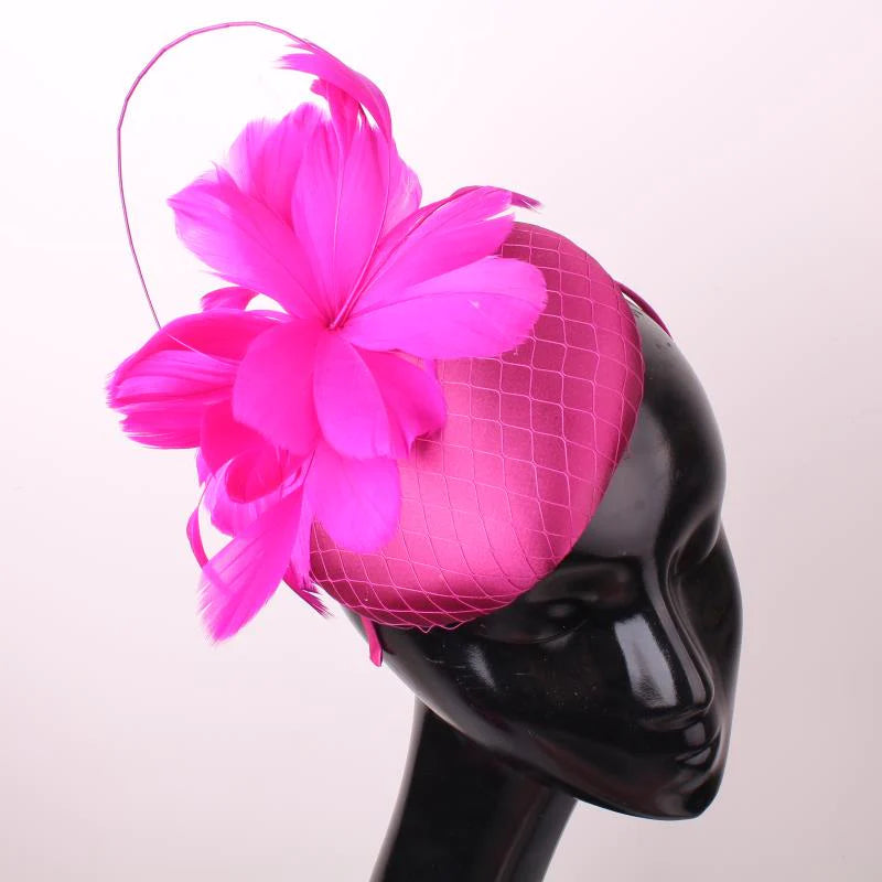 Pillbox style fascinator with feather and spike detail on band D04